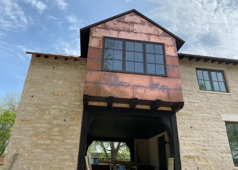 Copper metal panel facade on a stone building for Metal Roof Coating in Oakbrook