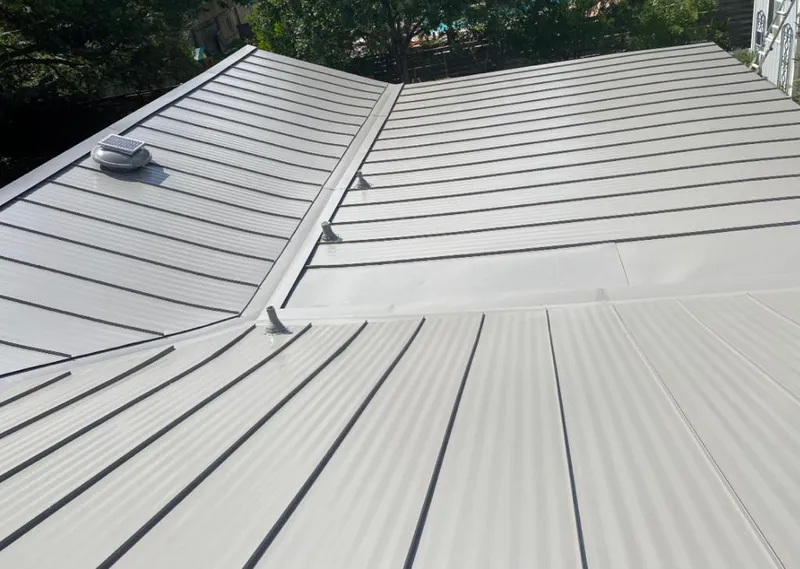 Solar attic fan installed on a metal roof for Roof Ventilation in Oakbrook